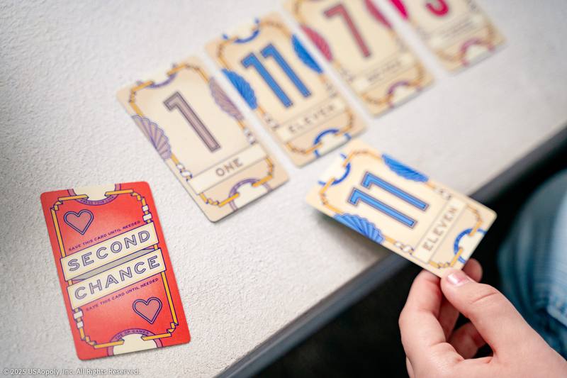 A player revealing an eleven card beside a Second Chance card