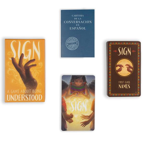 Sign box, booklet and two card decks arranged on white