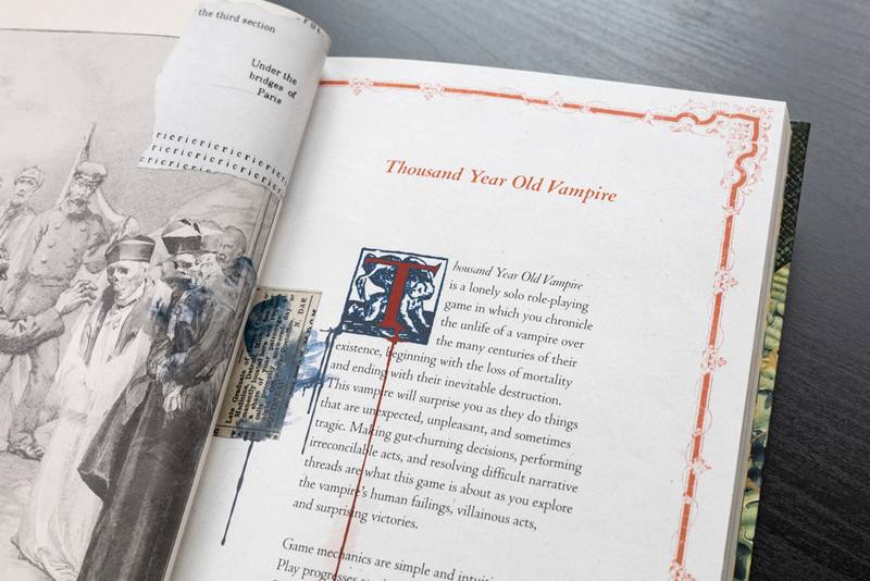 Open Thousand Year Old Vampire book showing its introduction and collage art