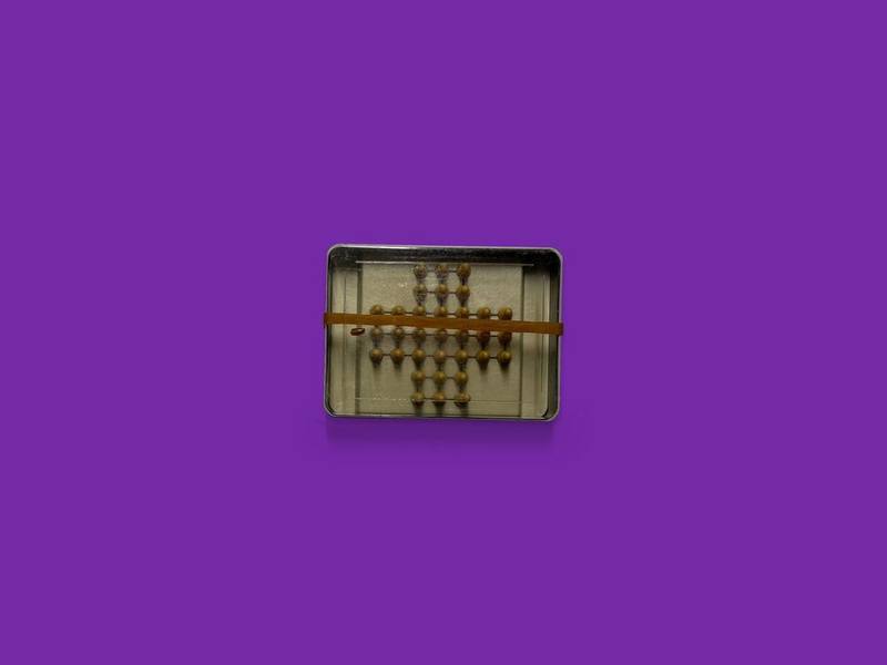 Miniature abacus photographed on Bruno's purple Applied Games background