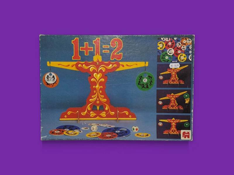 1+1=2 photographed on Bruno's purple Applied Games background