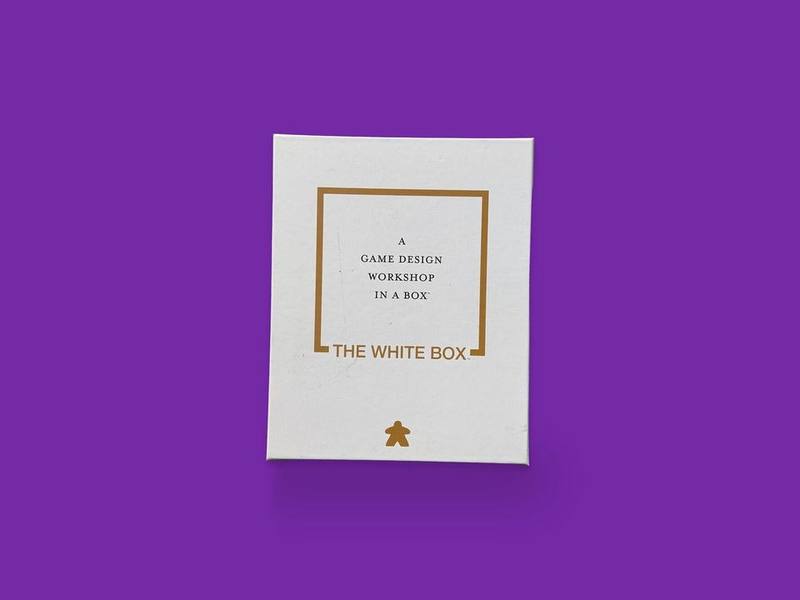 A Game Design Workshop in a Box photographed on Bruno's purple Applied Games background