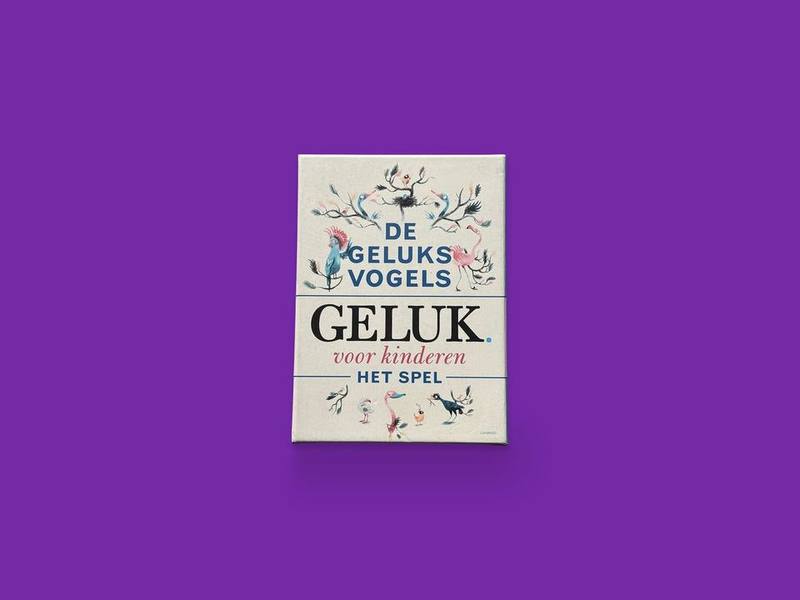 De Geluksvogels: Geluk voor kinderen, het spel photographed on Bruno's purple Applied Games background