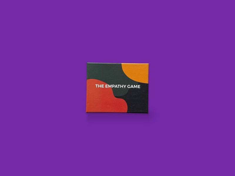 The Empathy Game photographed on Bruno's purple Applied Games background