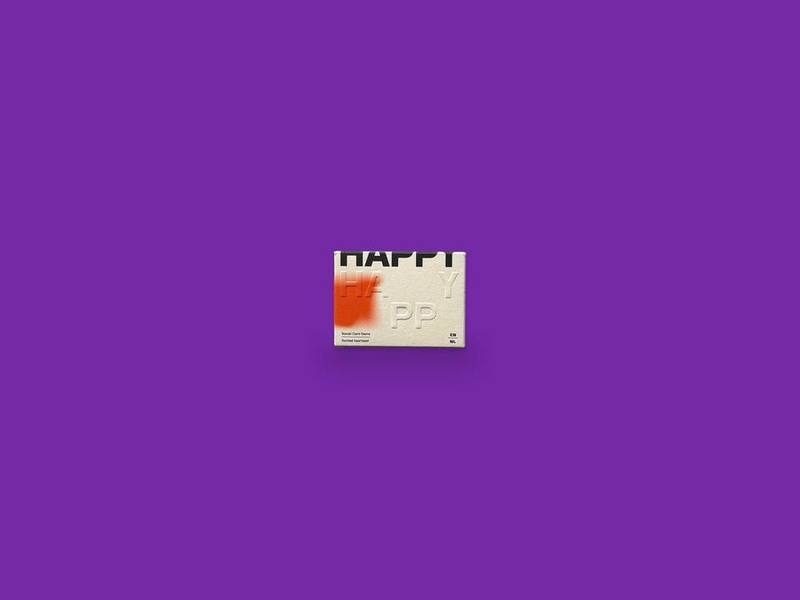HAPPY Social Card Game photographed on Bruno's purple Applied Games background