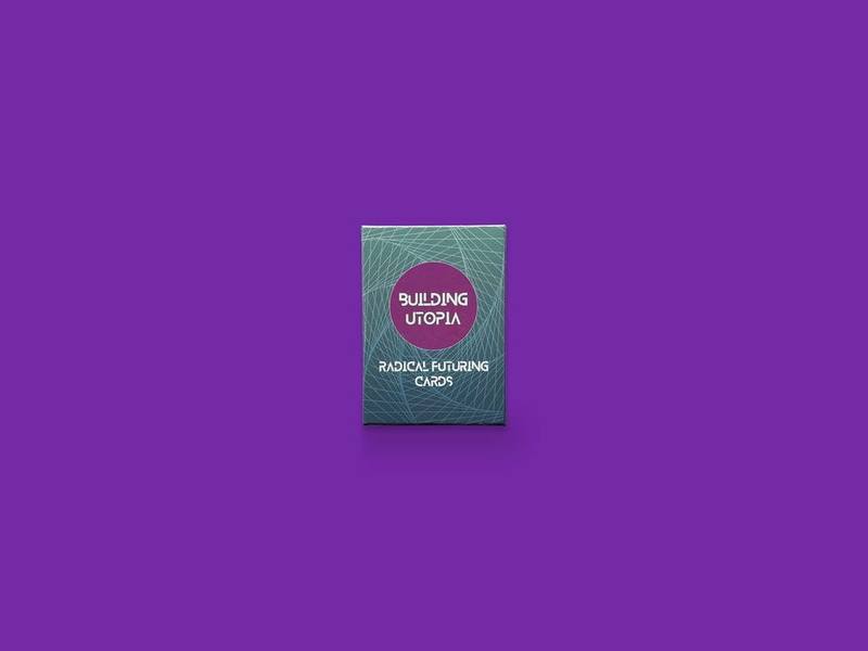 Building Utopia: Radical Futuring Cards photographed on Bruno's purple Applied Games background